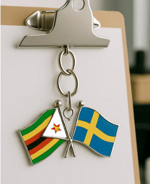 Key chain with Zimbabwean and Swedish flags side by side