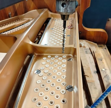 Accordeur de pianos Lyon- Réparation pianos- Perçage sommier pianos