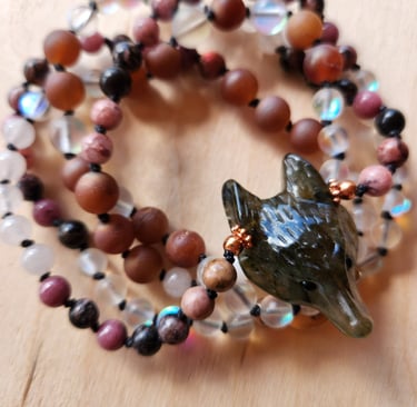 Hand-knotted gemstone mala necklace with 108 beads, created by Tina Medina for spiritual meditation and energy healing