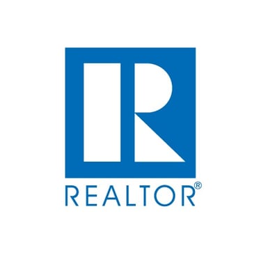 Blue and white REALTOR® logo featuring a stylized "R" within a square. Below, the word "REALTOR" is in bold capital letters.