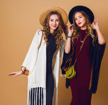 groomed-personality-girls-standing-with-hats-and-bags