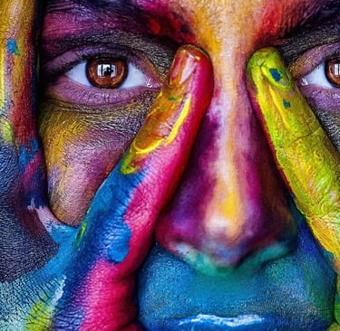 a woman with his hands on his face and painted hands