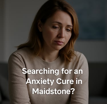 A person sits indoors in soft, natural light, appearing thoughtful and calm, reflecting on anxiety and emotional wellbeing.