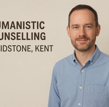Man in blue shirt with text: Humanistic Counselling in Maidstone, Kent.