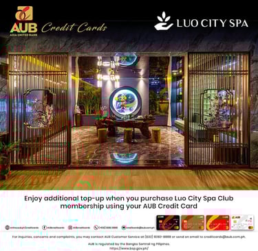 a hotel lobby with a large screen displaying a photo of a hotel