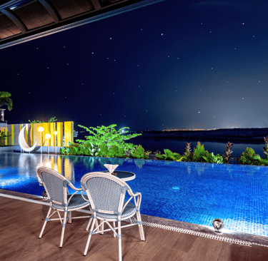 Rooftop infinity pool at Luo City Spa Manila overlooking the city lights and night sky