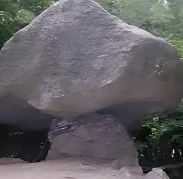 ietra Pendula boulder balancing on rock stem near Torno, Lake Como
