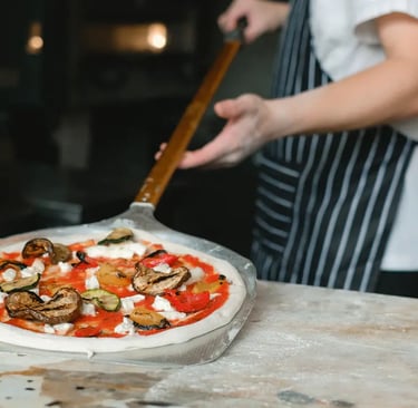 a person is cooking a pizza on a pizza, neapolitan pizza of naples