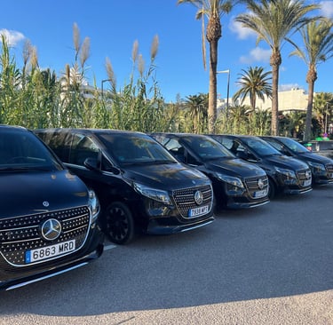 a row of cars parked in a parking lot