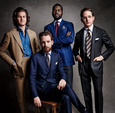 a group of men in suits and ties posing for a photo