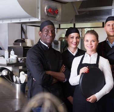 a group of chefs and staffs in Restaurant uniform