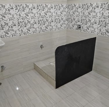 a bathroom with a shower and toilet