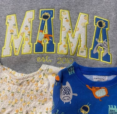Custom Applique Sweatshirt made of children's onesies.