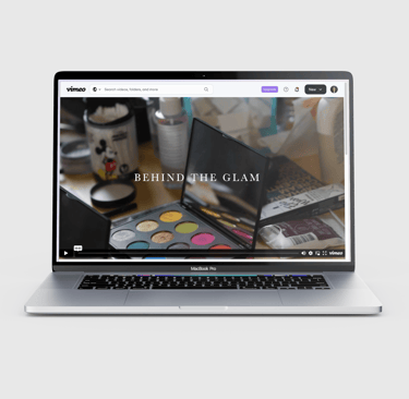 Laptop screen displaying 'Behind the Glam' documentary on Vimeo.