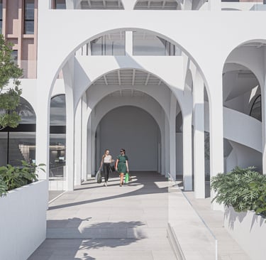 a group of people walking through a building