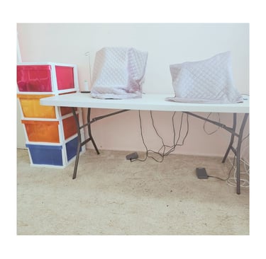 Marg’s neat sewing desk with machines set up & additional storage close by