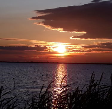 a sunset over a body of water