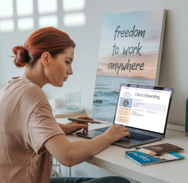 a woman sitting at a desk with a laptop and a laptop