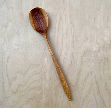 Apple cooking spoon with hand-carved feather details