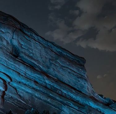 Red rocks in blue light at night