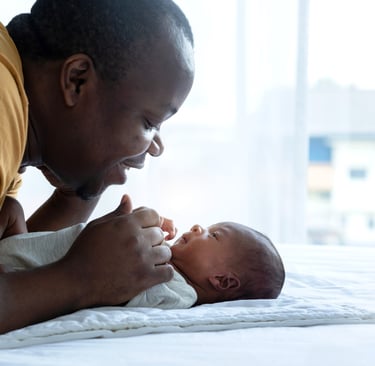 Dad playing with baby