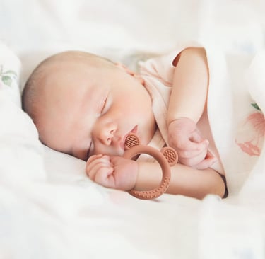 baby with teething ring