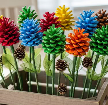 a wooden box with pine cones and pine cones