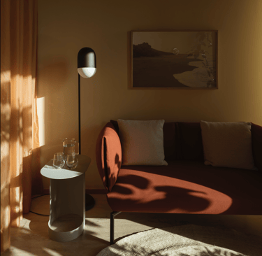 Warm, cozy consultation or lounge room with soft lighting and minimalist decor.