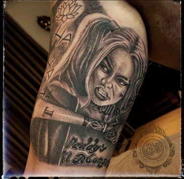 Realistic tattoo of Harley Quinn on the bicep