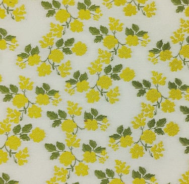 Jacquard fabric with yellow and white green leaves and flowers