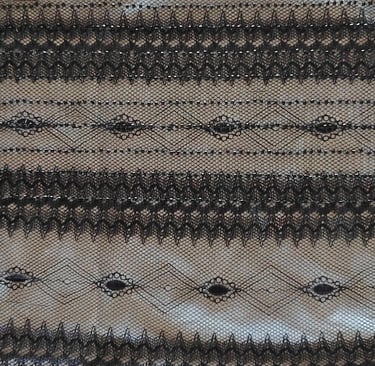 a black lace with a black  lace trimming