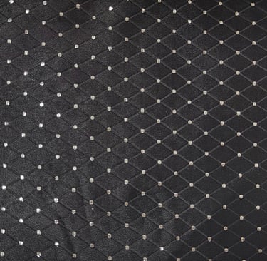 jacquard fabric with white polka dots in a black diamond  check