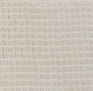 a white and beige jacquard fabric with a pattern of wavy lines