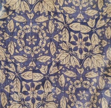 a blue and white patterned cloth with a pattern of leaves
