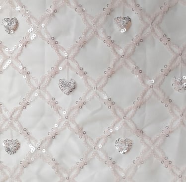 a white fabric with   sequinous