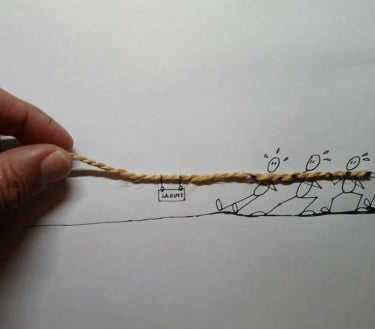 a person holding a string rope with a rope