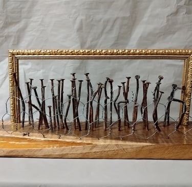 sculpture with nails representing humans