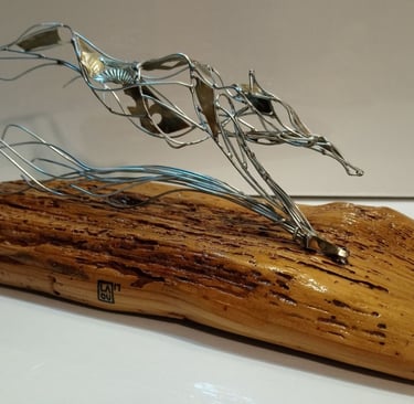a sculpture of a dog on a wooden block