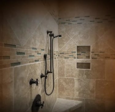 Modern tiled shower showing waterproofing work, emphasizing the need for expert evaluation in water damage insurance disputes