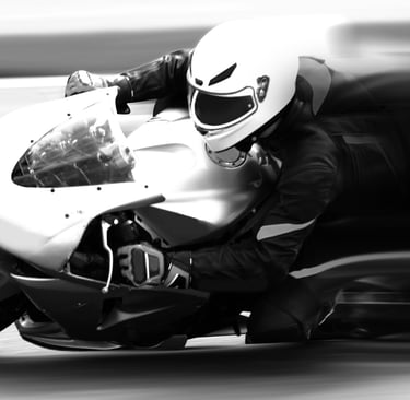Motorcycle moving from right to left with speed as it is thought to be taking a corner