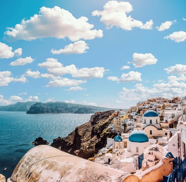 Beautiful view of Santorini with blue domes and calm September skies