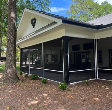 Elegant screened porch with custom framing and high-quality screens, designed for year-round outdoor