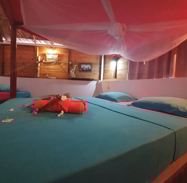Bedroom inside a beachfront bungalow at Ocean Lodge, overlooking Sakalava Bay near Diego Suarez, Mad