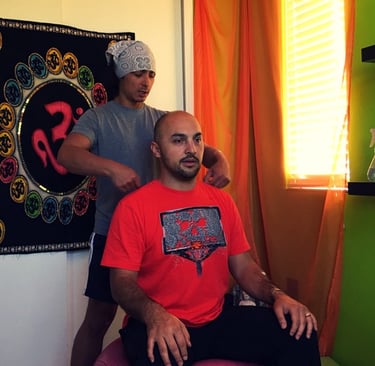 Joshua Fabia doing bodywork on a man