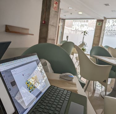 a laptop computer sitting on a table in a restaurant
