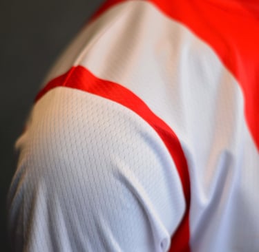 a close up of a man's shirt with a red and white shirt