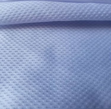 a close up of a white shirt with a blue background