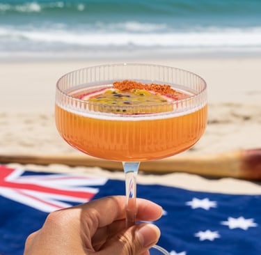 Holding a a Killer Bee cocktail against an Australia day beach scene with the flag and digeridoo