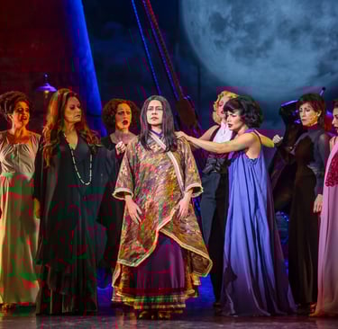 a group of people in costumes on stage