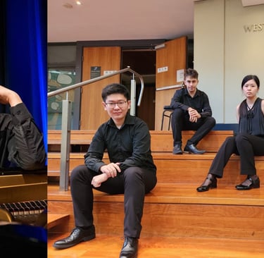 a man sitting on a set of stairs with a piano
